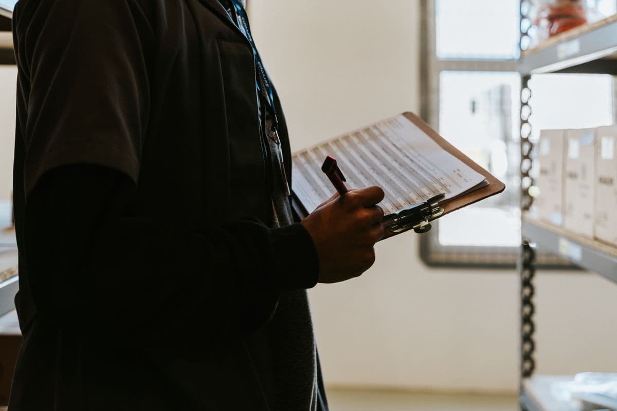 clipboard with inspection checklist and pen on a desk