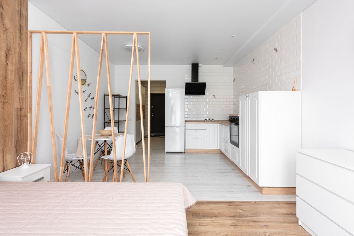 a bright, minimalist living room in a smaller home with clean lines and natural light