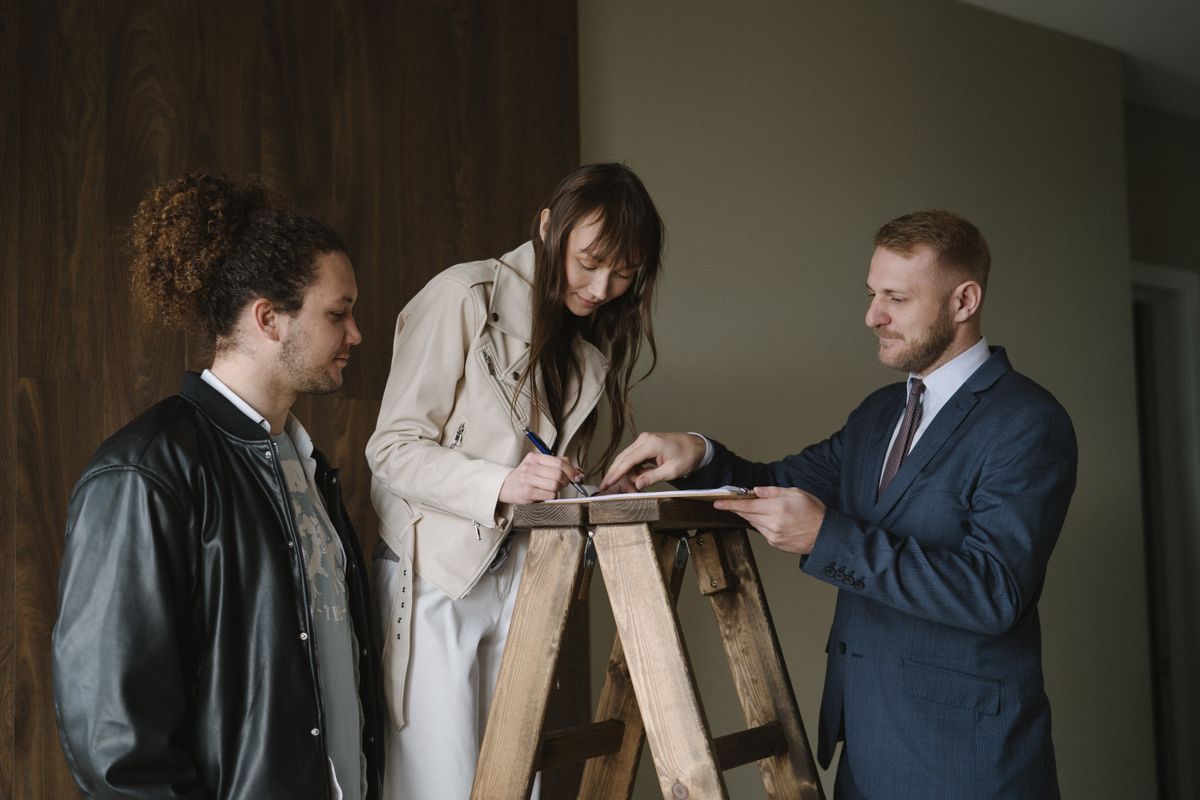 real estate agent reviewing property documents with client